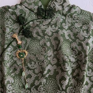 Elegant Green pendant hanger with gold accents.